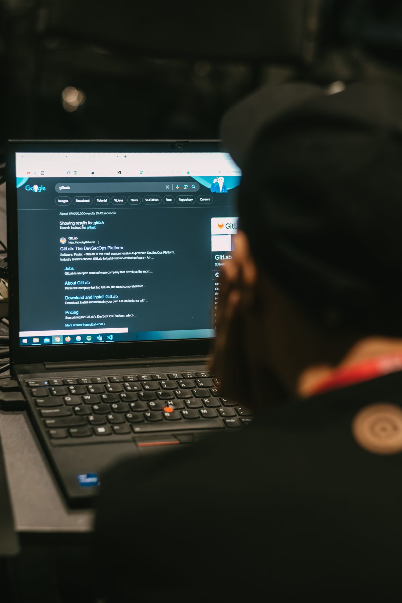 A PlayPatrol tester searching on a laptop